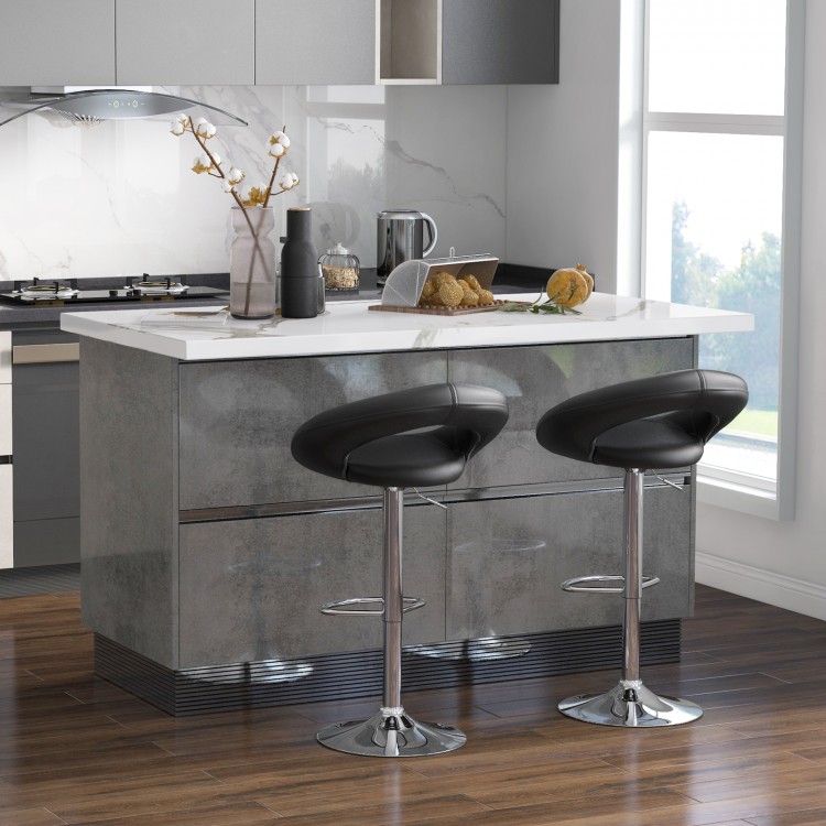 Height adjustable black bar stools with hollow back and footrest, featuring a sleek design and 360-degree swivel for.