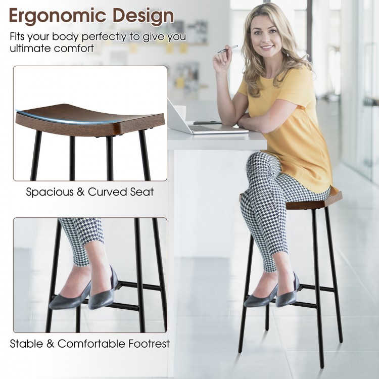 Industrial saddle bar stool with metal legs, featuring a contoured seat and footrest, ideal for kitchen or bar use.