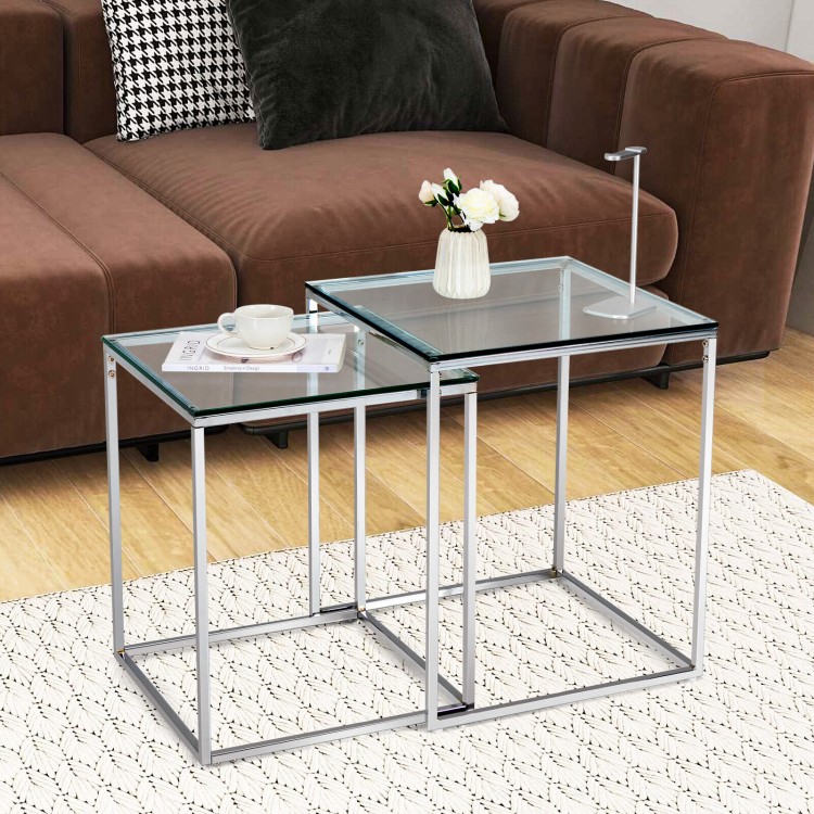 Modern nesting coffee table set with a sleek silver steel frame and tempered glass top, perfect for contemporary.