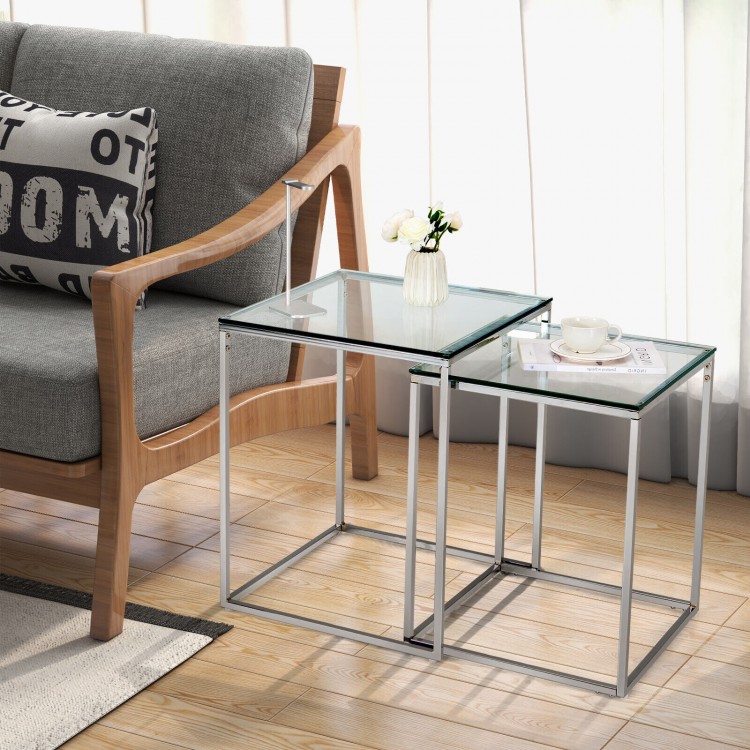 Modern nesting coffee tables with tempered glass tops and steel frames, ideal for stylish and space-saving arrangements.
