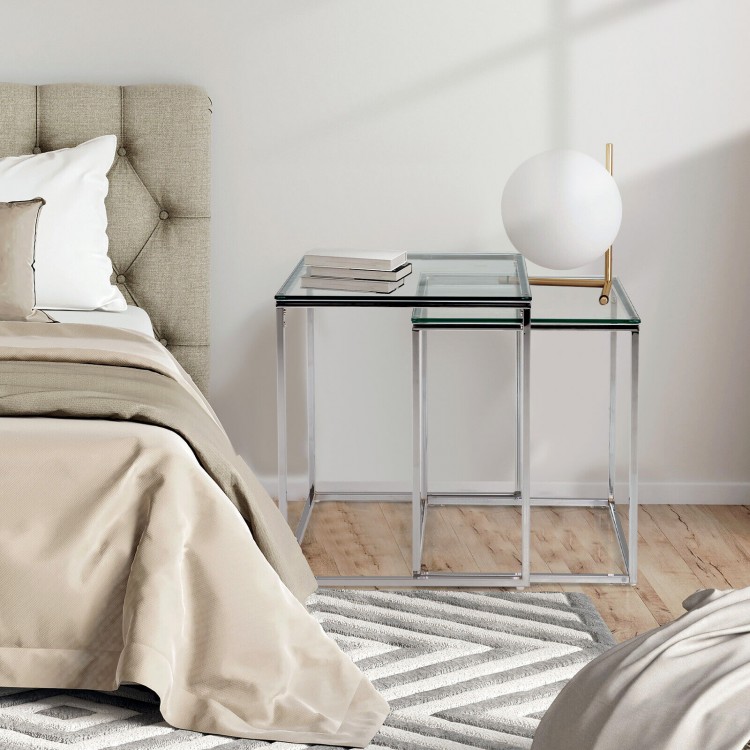 Modern nesting coffee tables with tempered glass tops and steel frames, perfect for stylish and space-saving.