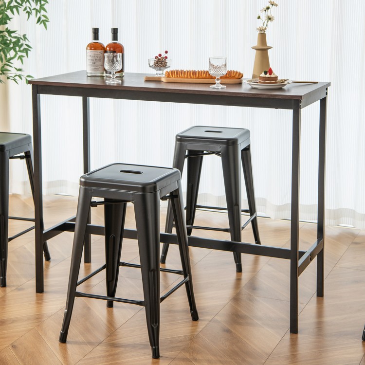 Black 24-inch Tolix style counter height barstools with a stackable design, perfect for kitchen or home bar use.