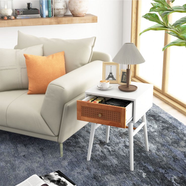 Modern bedside table with solid wood legs, rattan front panel, and a large drawer, ideal for bedroom or living room use.