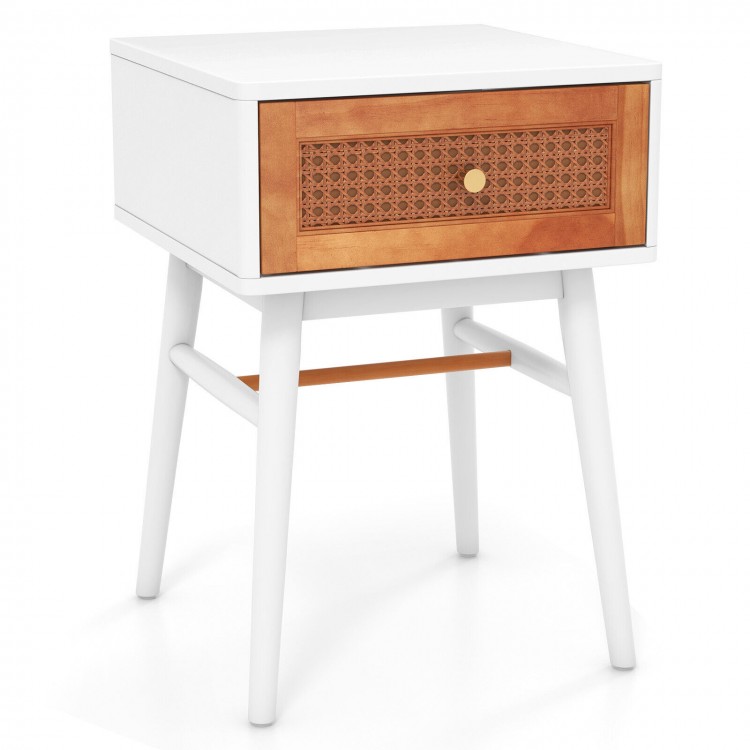 Modern bedside table with solid wood legs, rattan front panel, and large drawer for convenient storage in white finish.