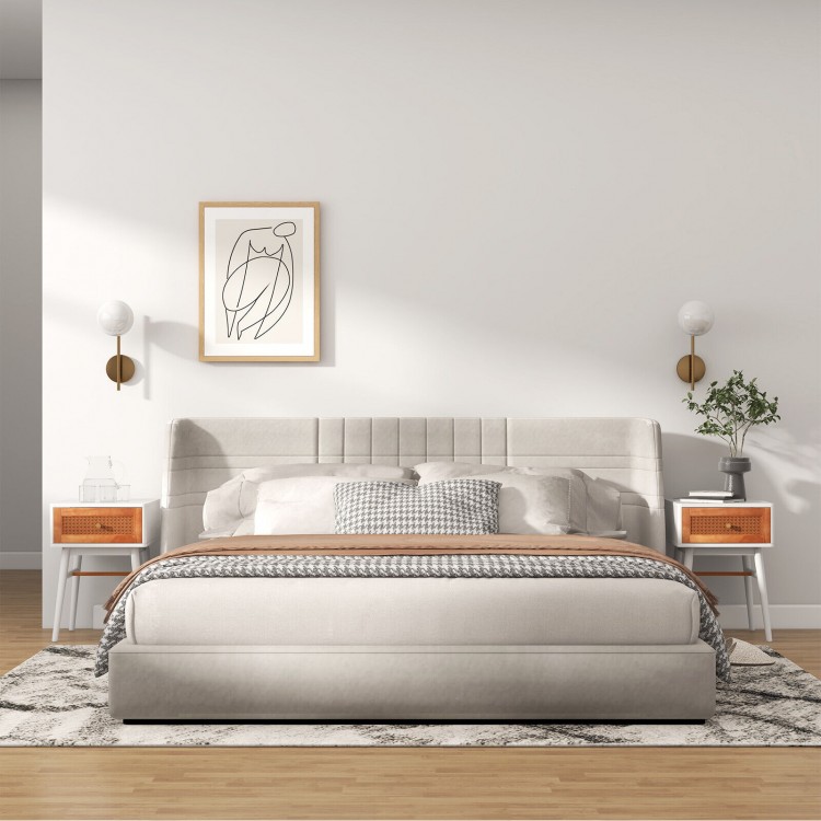 Modern bedside table with solid wood legs and rattan front panel, ideal for bedroom or living room storage.