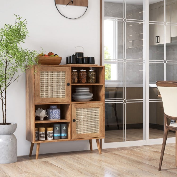 Rattan buffet cabinet with 2 doors and 2 cubbies in natural wood, ideal for kitchen or dining room storage.