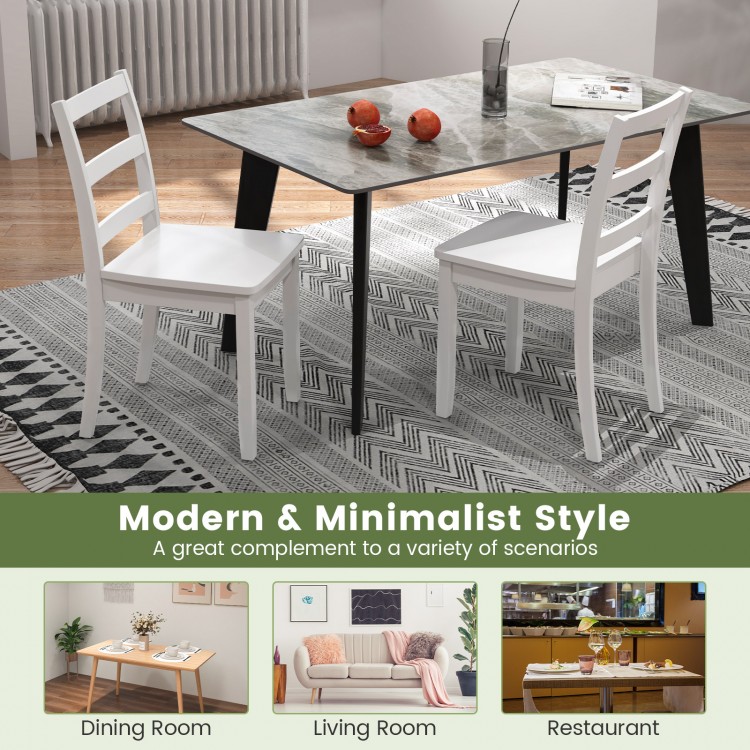 Set of 2 white wood dining chairs with solid rubber wood legs, featuring a modern minimalist design for versatile use.