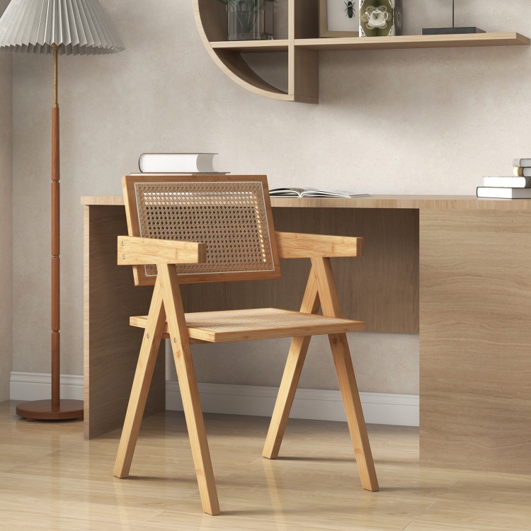 Single rattan accent chair with natural bamboo frame, showcasing a wide sitting area and mid-century design for.