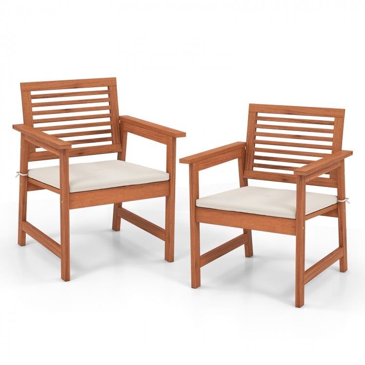 Set of 2 solid wood patio dining chairs with cushions, featuring slatted seats for backyard or poolside use.