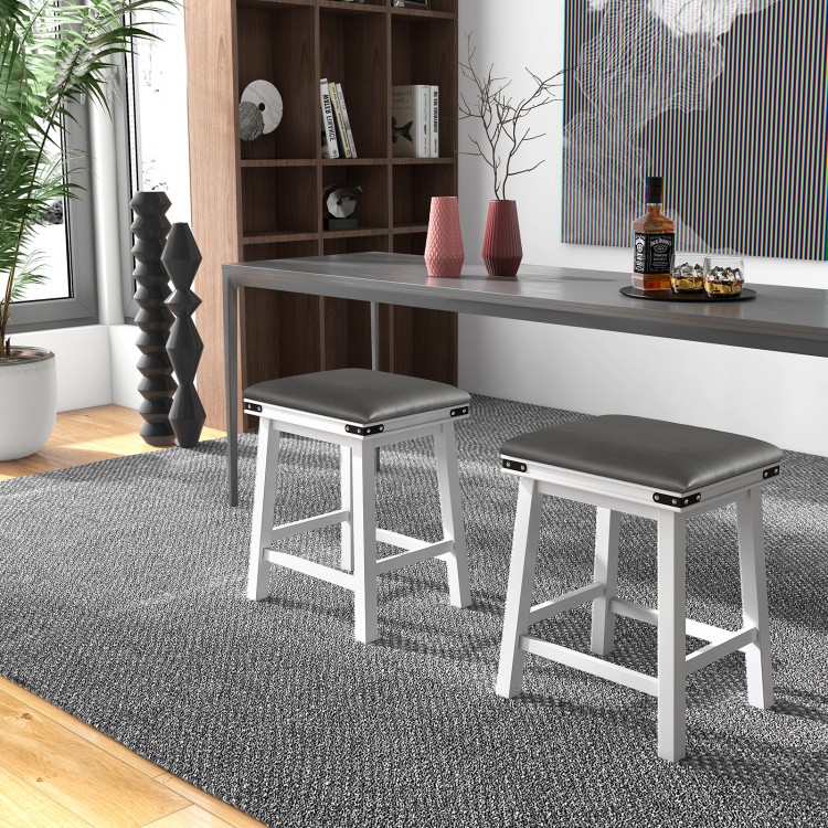 Two 24-inch dining bar stools with sponge padded seats and decorative rivets, perfect for stylish kitchen or dining.