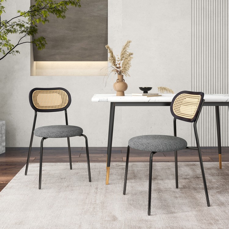 Set of 2 gray rattan dining chairs with metal legs, featuring ergonomic backrests and padded seats for comfort.