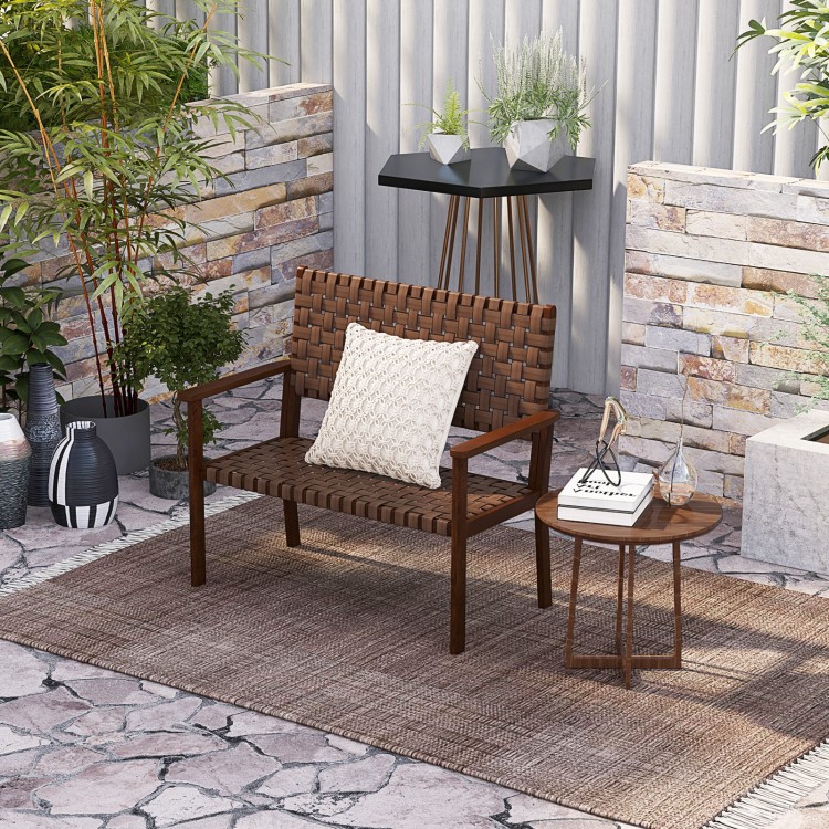 Outdoor all-weather bench with solid rubber wood frame and hand-woven PU leather, perfect for patio relaxation.