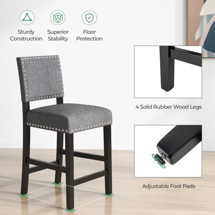 Counter height chair with solid rubber wood frame, cushioned seat, and decorative rivets for stylish comfort.