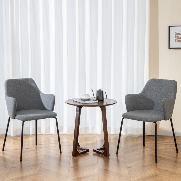 Set of 2 gray dining chairs with curved backrests and armrests, featuring a stable metal frame for comfort and support.