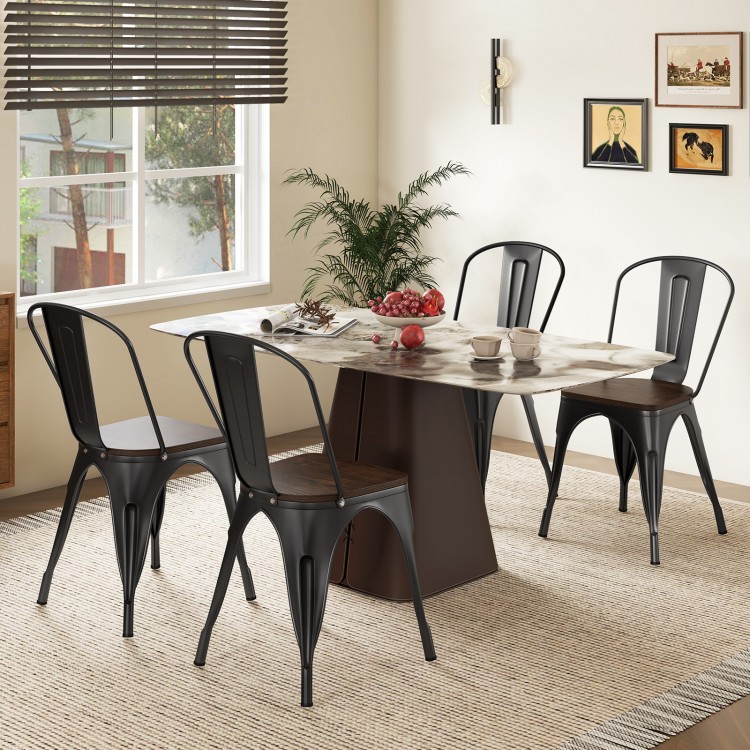 Set of 4 black Tolix style stackable metal dining chairs with wood seats, perfect for kitchen or bistro use.