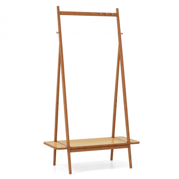 Bamboo clothes rack with hanging rod, rattan shelf, and copper hooks for organized entryway or bedroom storage.