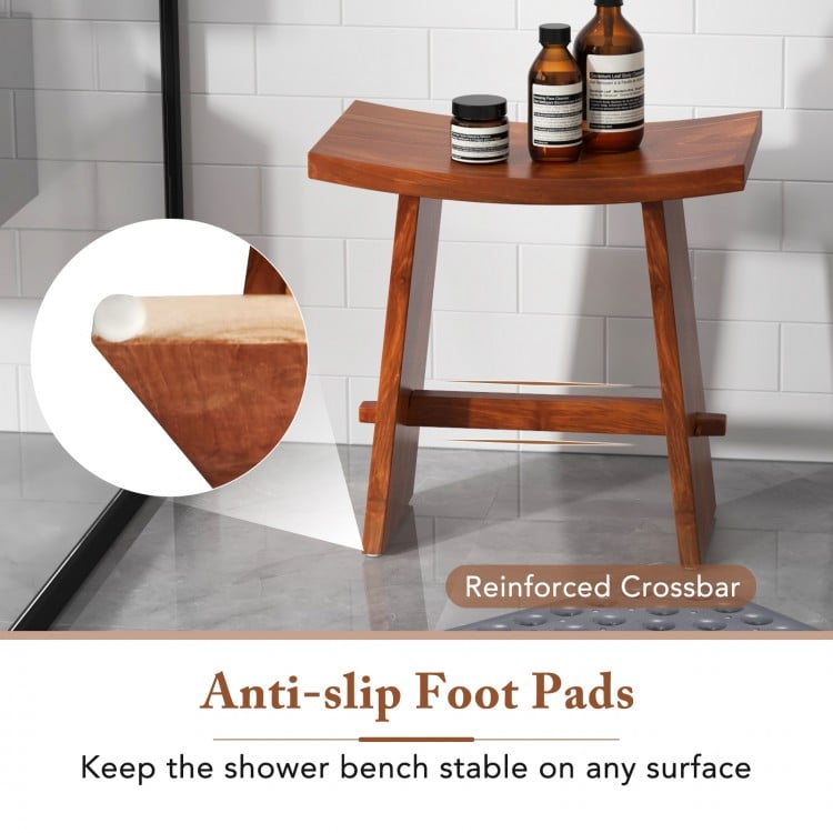 Curved teak wood shower stool with anti-slip foot pads for stability, ideal for indoor and outdoor use.
