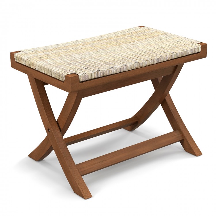 Folding natural rattan ottoman with hand-woven seat, crafted from durable Indonesian teak wood for space-saving comfort.