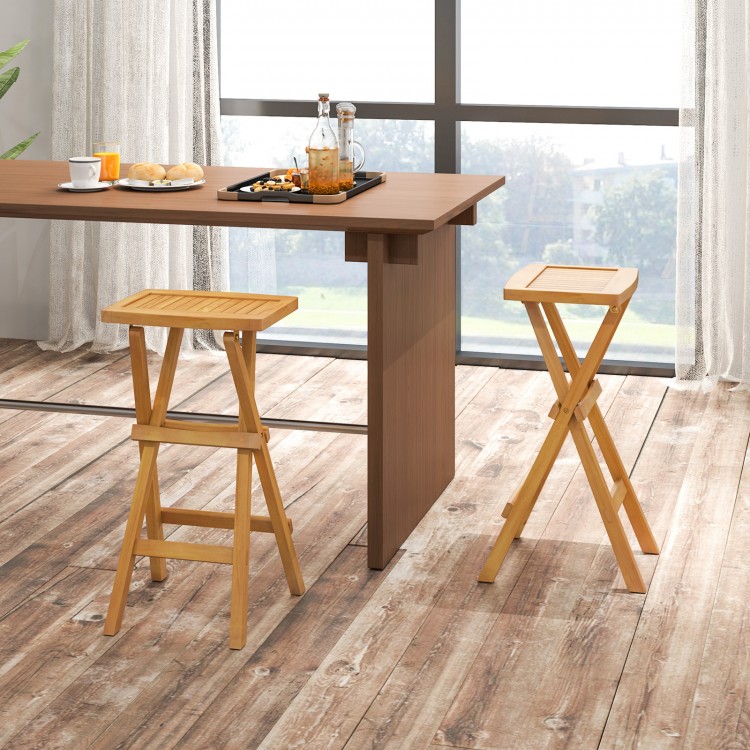 Set of 2 folding outdoor bar stools with ergonomic teak wood seats and stable x-shaped frames for easy storage.