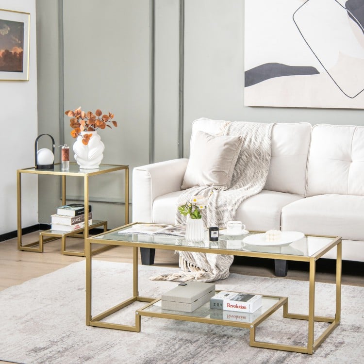 Modern 2-tier rectangular coffee table with a glass top and golden frame, featuring an extra shelf for convenient.