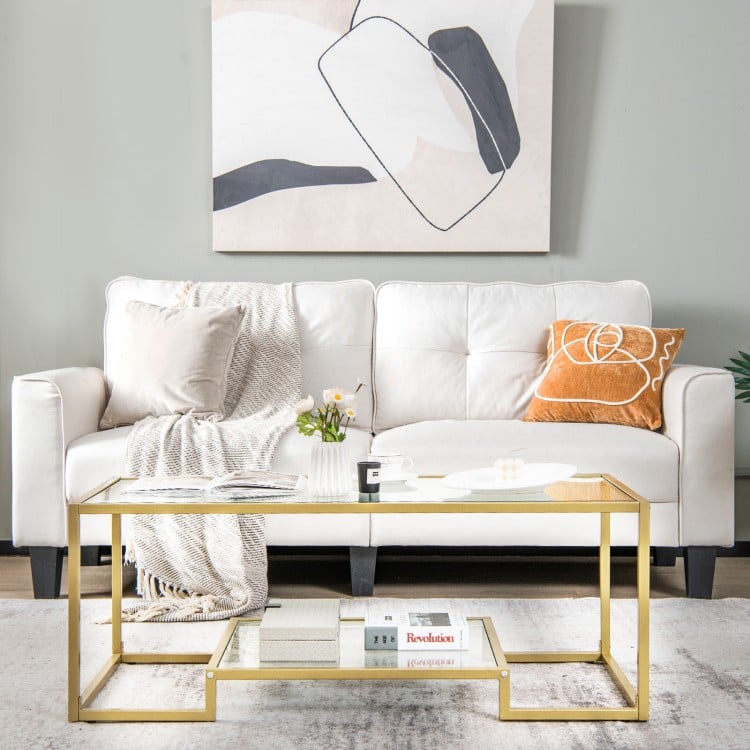 Modern 2-tier rectangular coffee table featuring a sleek glass top and golden frame, perfect for showcasing decor or.