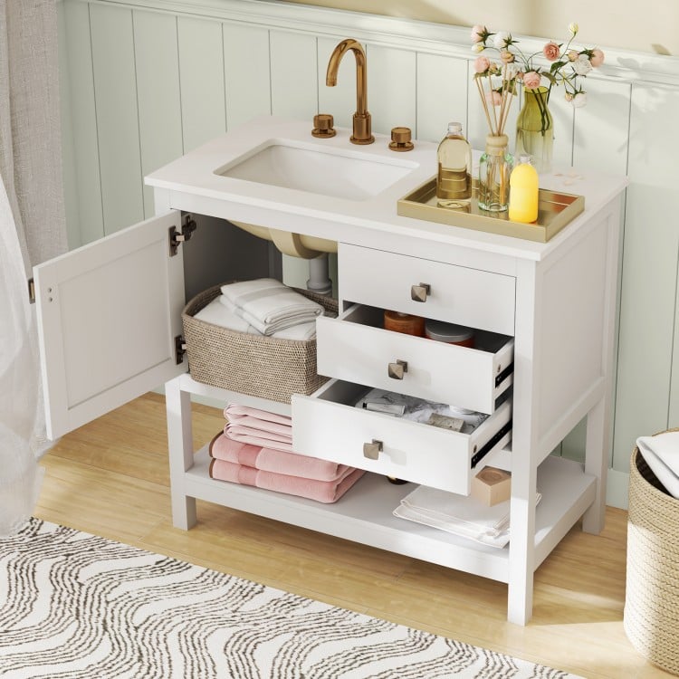 Freestanding bathroom vanity unit in white showcasing a spacious countertop with grooming essentials and decorative.
