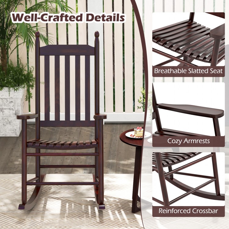 High-back acacia wood outdoor rocking chair with slatted seat and cozy armrests, perfect for backyard relaxation.