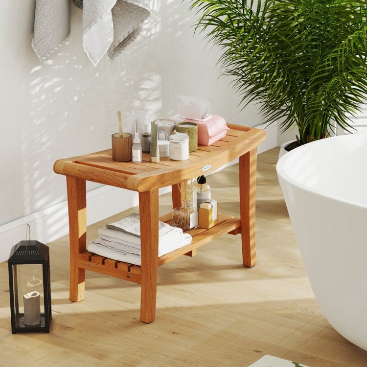 Teak shower stool with storage shelf, featuring a slatted design and non-slip footpads, perfect for bathroom.
