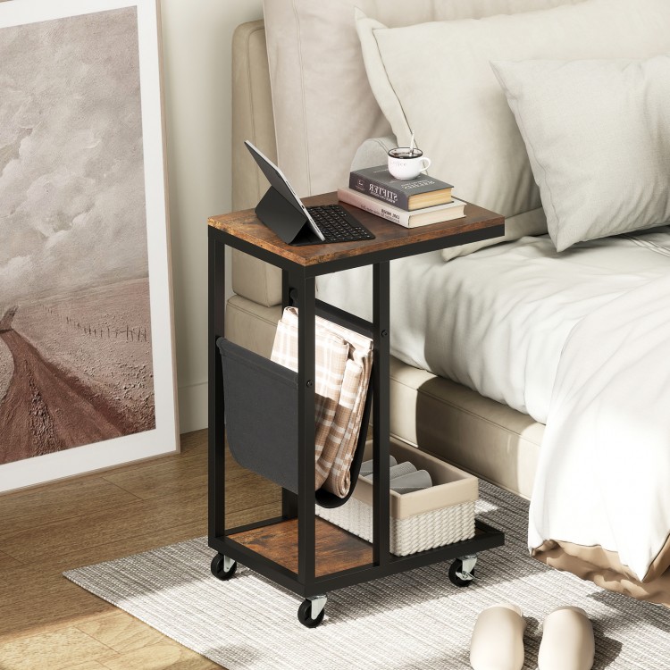 C-shaped side table with a brown wood top, metal frame, and canvas storage pouch, ideal for small spaces.