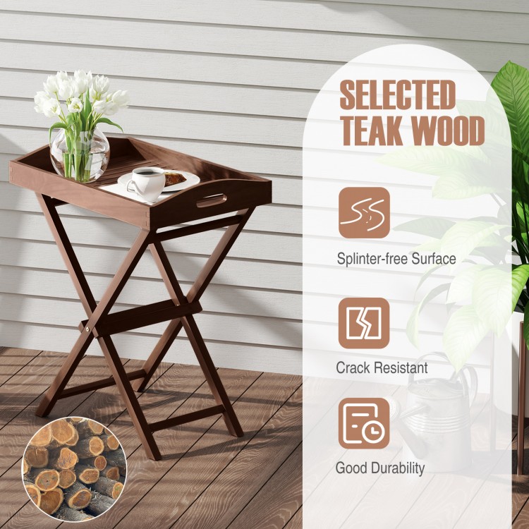 Solid teak wood tray table with removable top, featuring a sleek finish and foldable design for outdoor use.