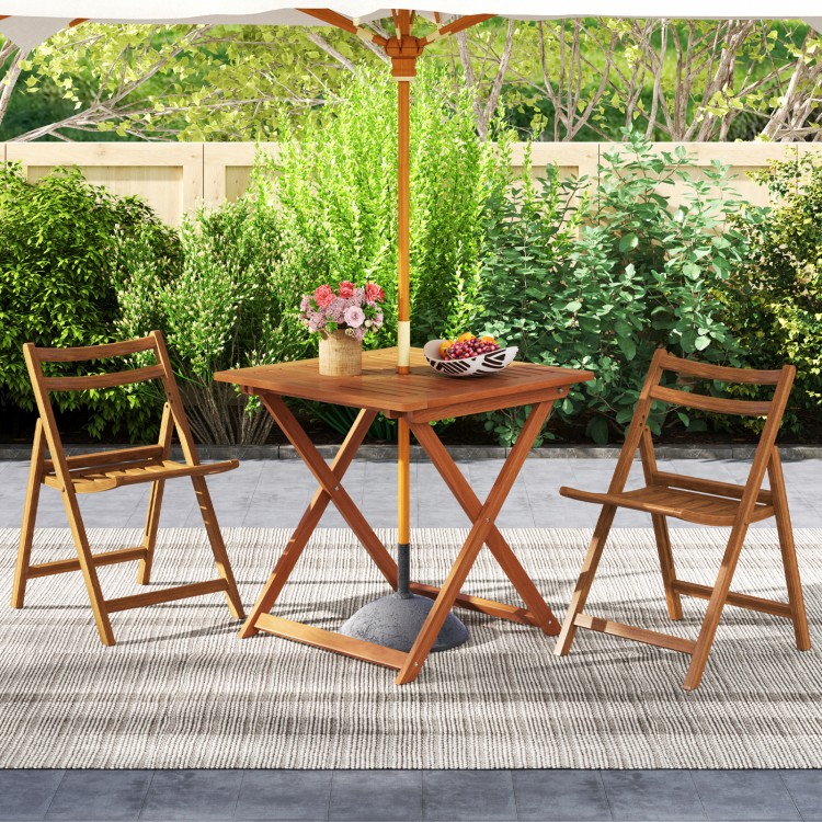Teak-finished 29.5-inch patio dining table with umbrella hole, ideal for backyard and poolside relaxation.