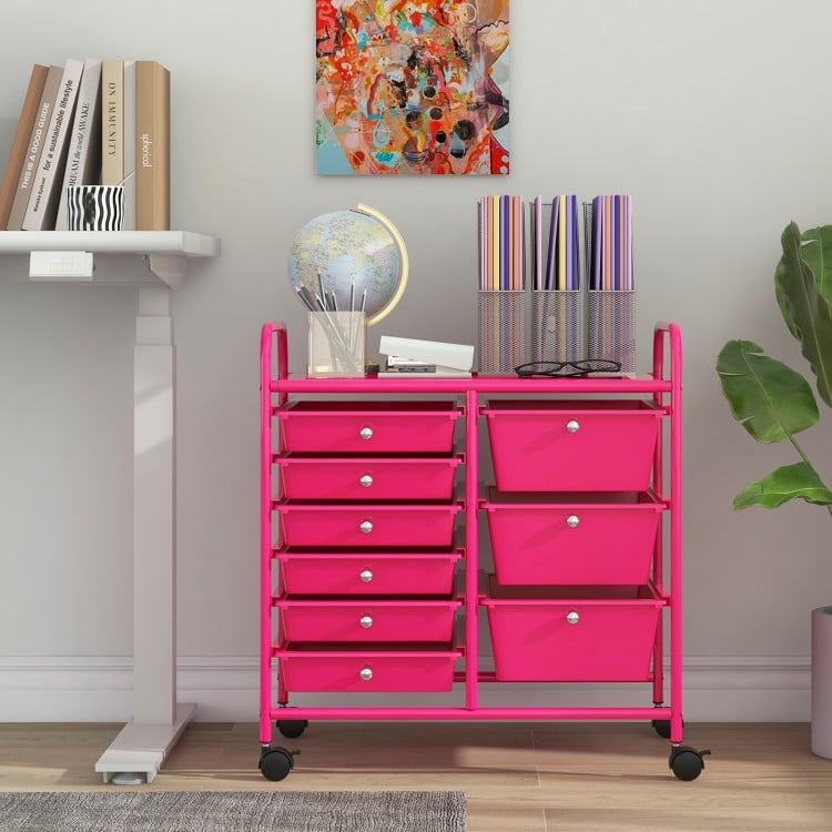 9-drawer rolling storage cart in light pink with a metal frame, ideal for organizing supplies in home or office.