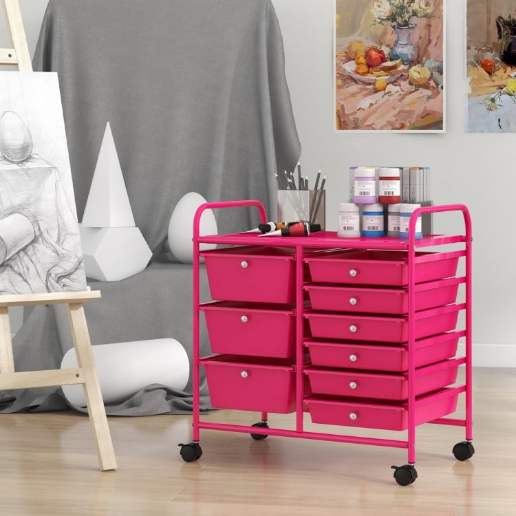 9-drawer rolling storage cart in light pink with metal frame, ideal for organizing supplies in home or studio.