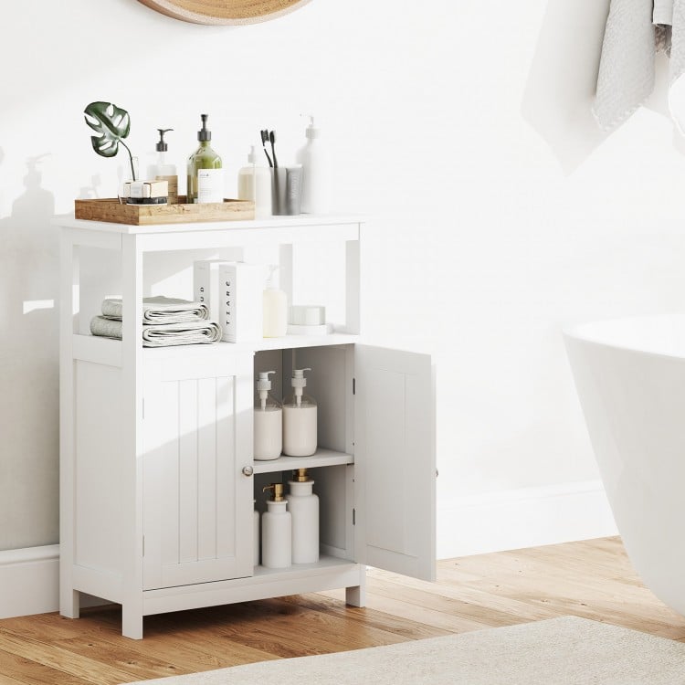 Freestanding white bathroom floor cabinet with open compartment, adjustable shelf, and two doors for organized storage.