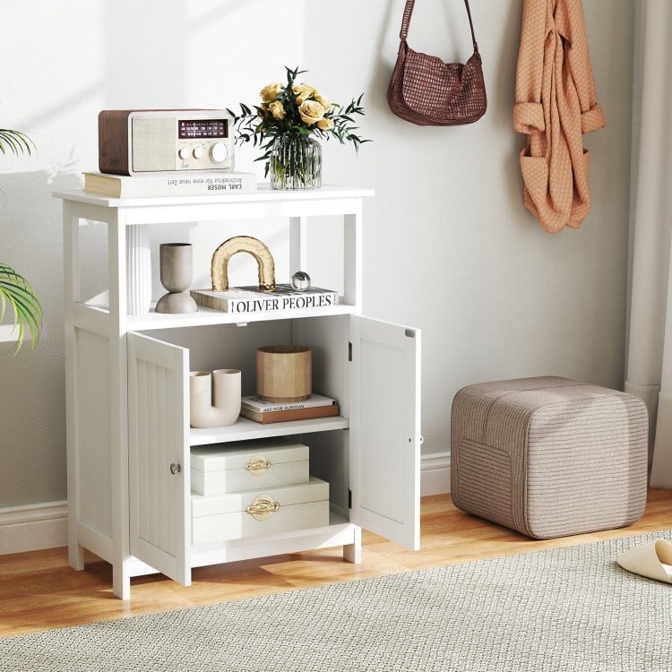 White freestanding bathroom floor cabinet showcasing an open compartment and a decorative top surface for added.