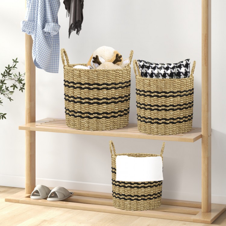 Stackable set of 3 woven seagrass baskets with handles, featuring a natural look for organized storage.
