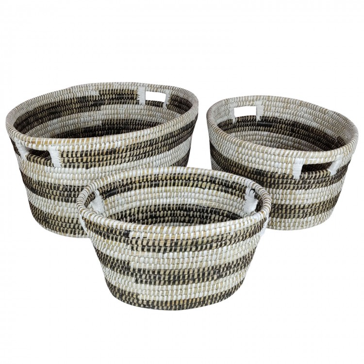Stackable set of 3 natural canes grass baskets with hollowed handles for convenient storage and organization.