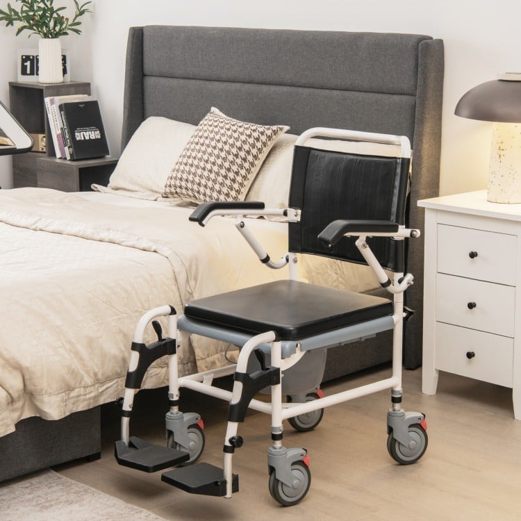 4-in-1 bedside commode wheelchair with detachable bucket, adjustable height, and waterproof PVC surface for versatile.