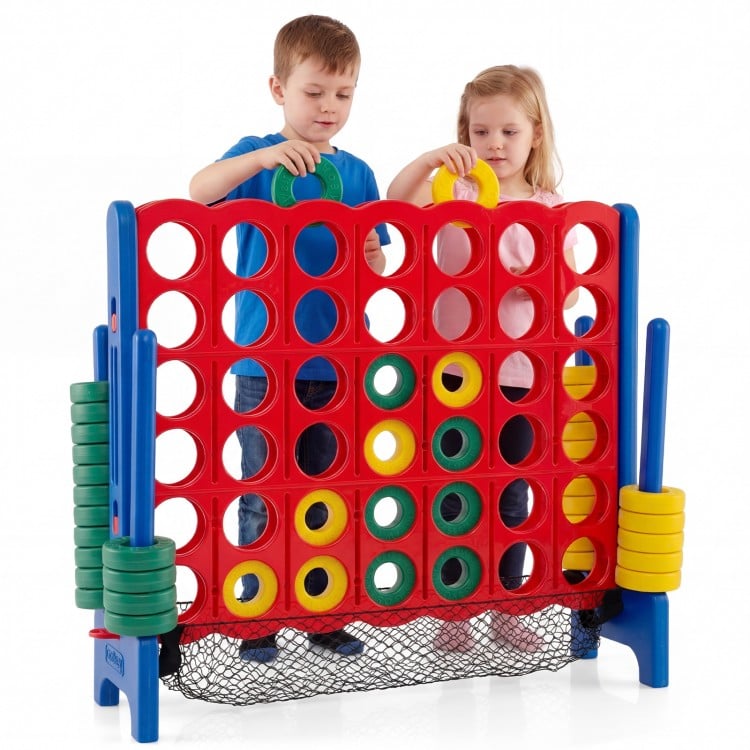 Children playing with the Jumbo 4 in a Row Game Set, featuring red and yellow chess pieces for indoor or outdoor fun.