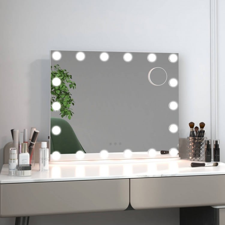 Close-up of the vanity mirror's smart control buttons and USB charging port for easy operation and convenience.