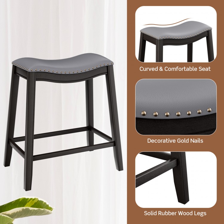 Upholstered bar stool with curved seat, gold nail accents, and solid rubber wood legs, perfect for dining or kitchen.