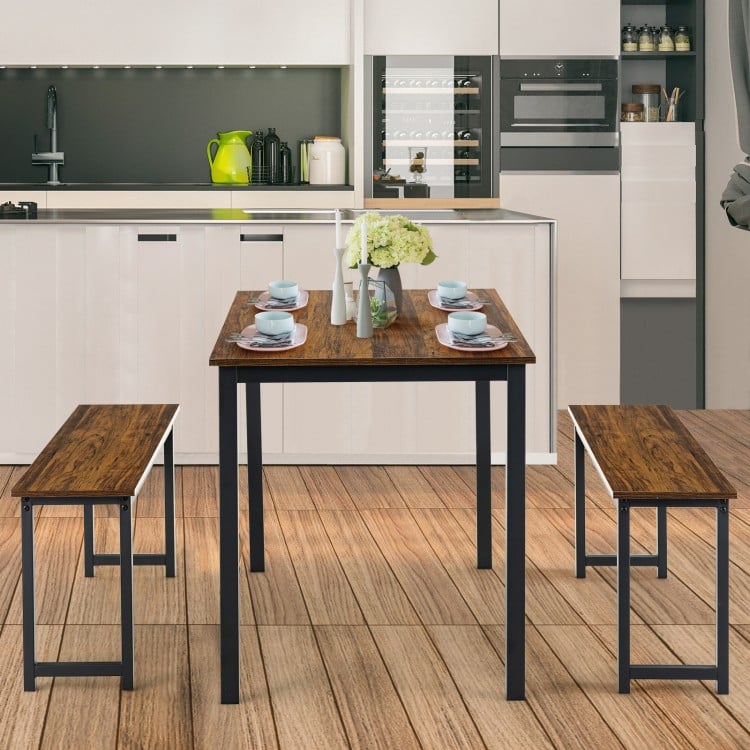 Compact brown dining table set with two benches, showcasing a smooth surface and stylish design for modern spaces.