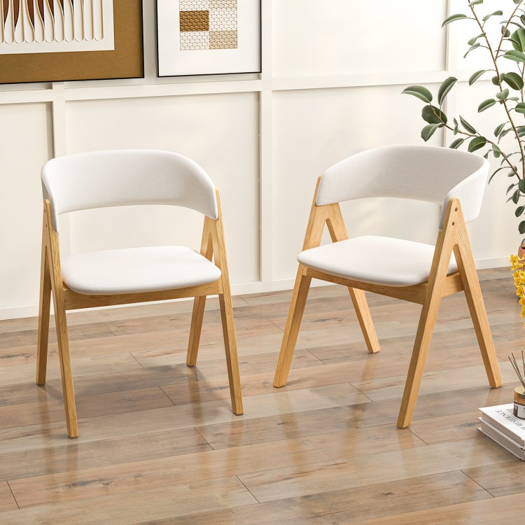 Set of 2 soft padded accent armchairs in natural and beige, featuring a durable rubber wood frame for dining room use.