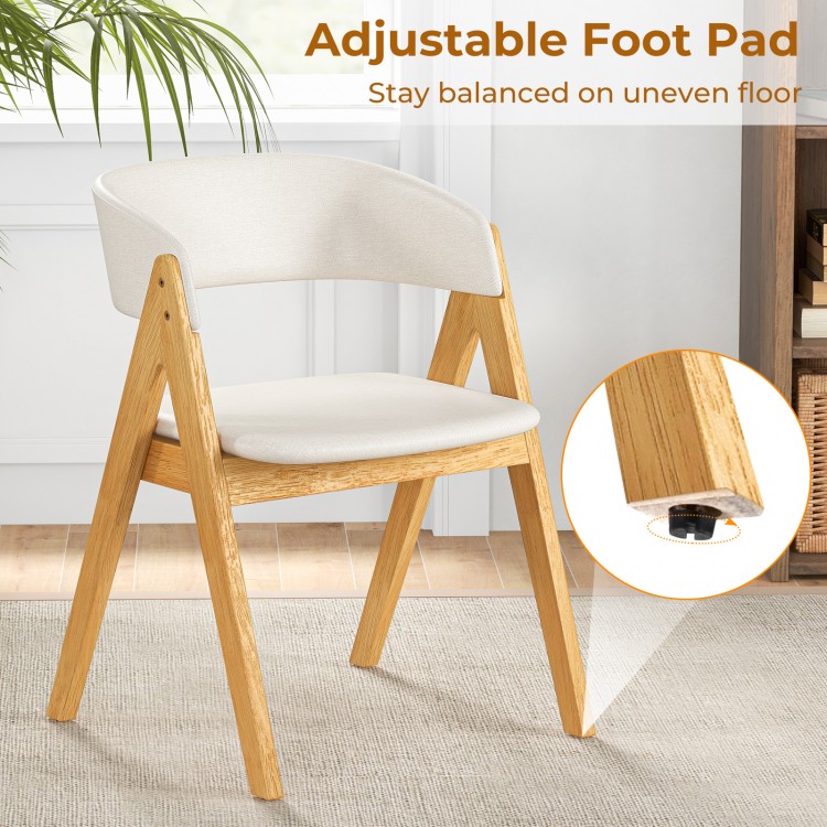 Soft padded accent armchair with adjustable foot pad in natural wood and beige upholstery, ideal for dining rooms.