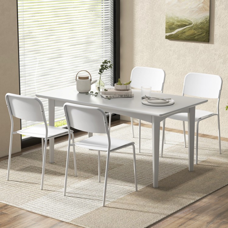 Modern dining table set featuring four white chairs with tilted backrests and sturdy metal legs, perfect for stylish.