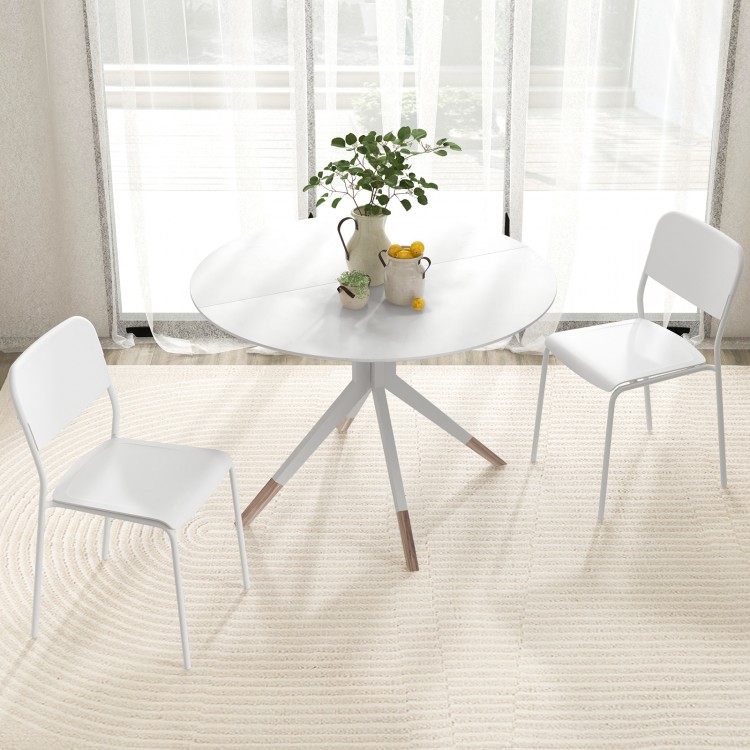Modern white dining table with two chairs, featuring a sturdy metal frame and tilted backrest for comfort.