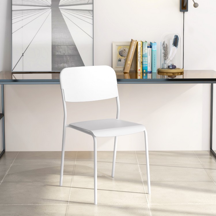 Modern white dining chair with tilted backrest and sturdy metal legs, ideal for stylish indoor or outdoor dining.