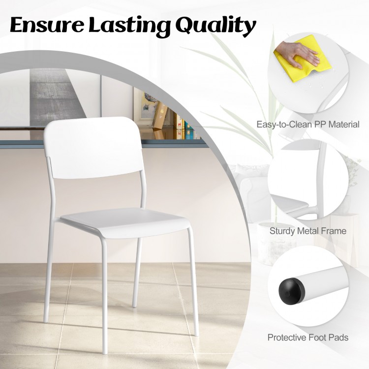 Modern white dining chair with sturdy metal legs and tilted backrest, designed for comfort and easy cleaning.