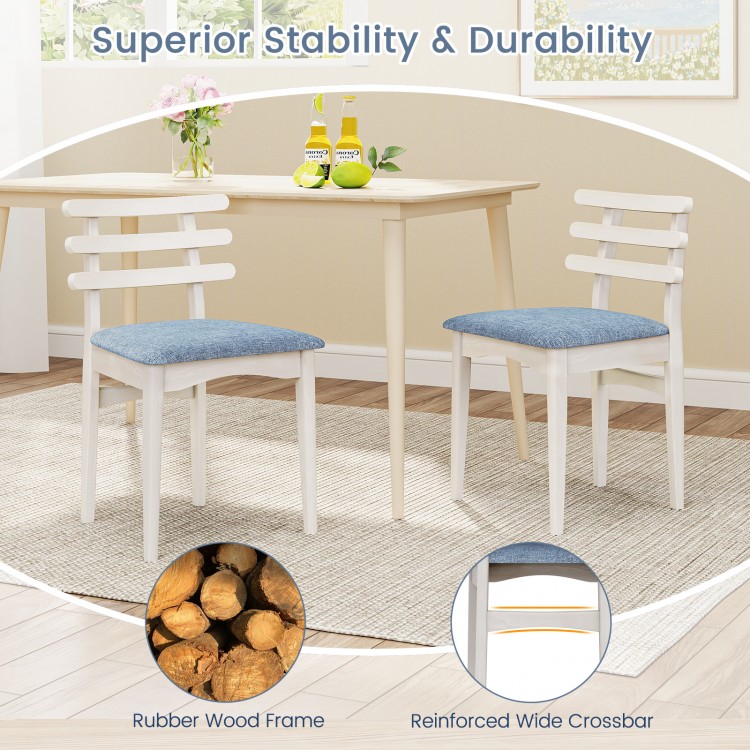 White fabric kitchen side chairs with rubber wood frame and padded seat, featuring ergonomic backrest for comfort.