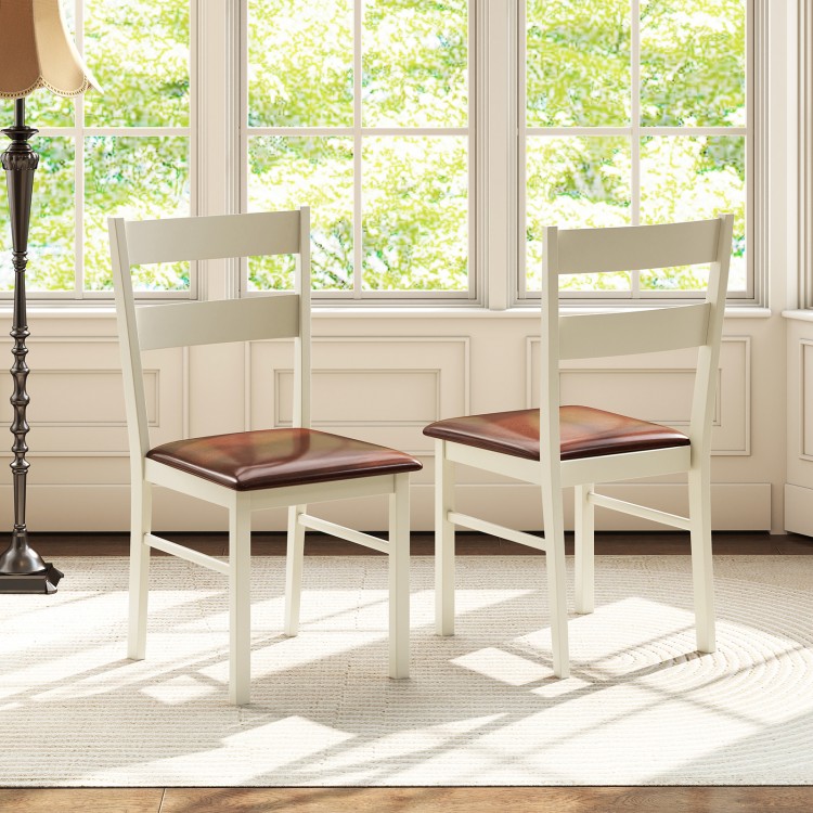 Two white wooden dining chairs with PU leather seats, perfect for home or restaurant use, showcasing elegant design.